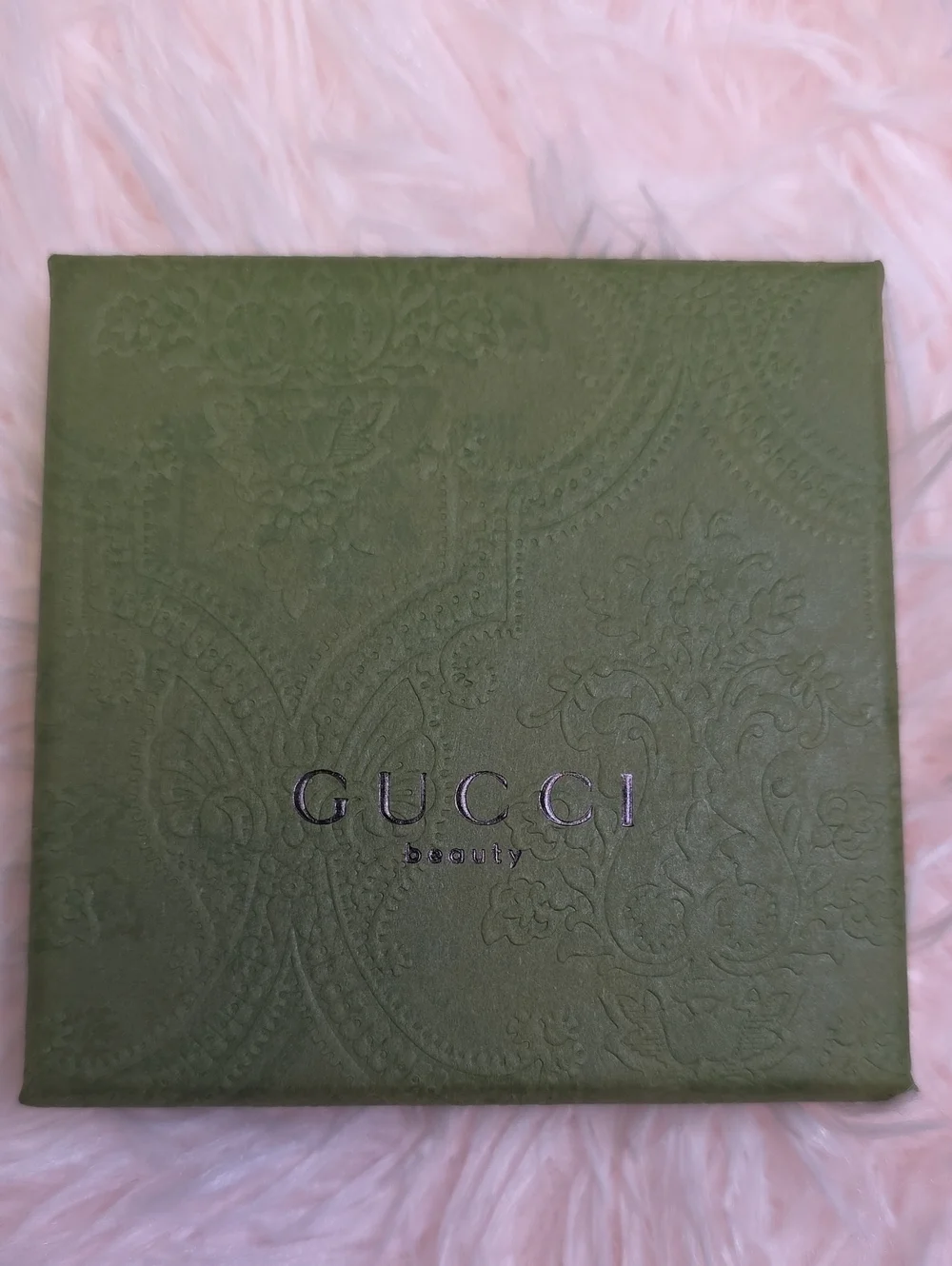 Gucci embossed olive green perfume box with subtle metallic logo